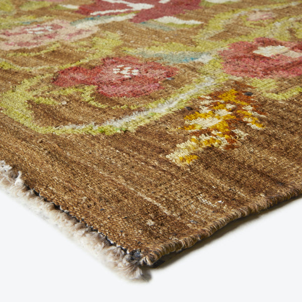 Close-up of a high-quality floral rug with vibrant colors.
