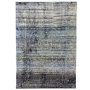 Modern, distressed rectangular rug in blues and grays exudes elegance.
