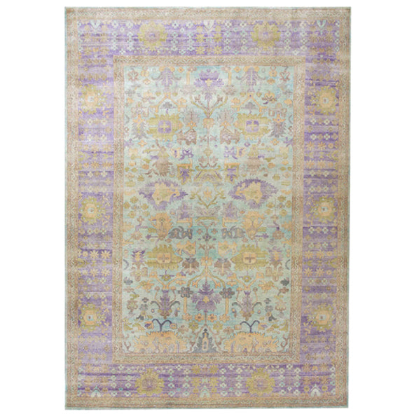 Symmetrical, ornate rug with intricate floral motifs in muted tones