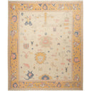 Handcrafted ornate rug with intricate motifs and vintage-inspired appearance.