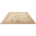 Vintage rectangular area rug with faded pattern on light background.