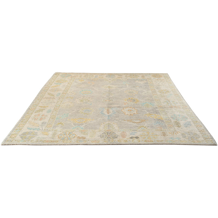 Vintage-inspired rectangular area rug with muted colors and intricate design