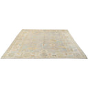 Vintage-inspired rectangular area rug with muted colors and intricate design