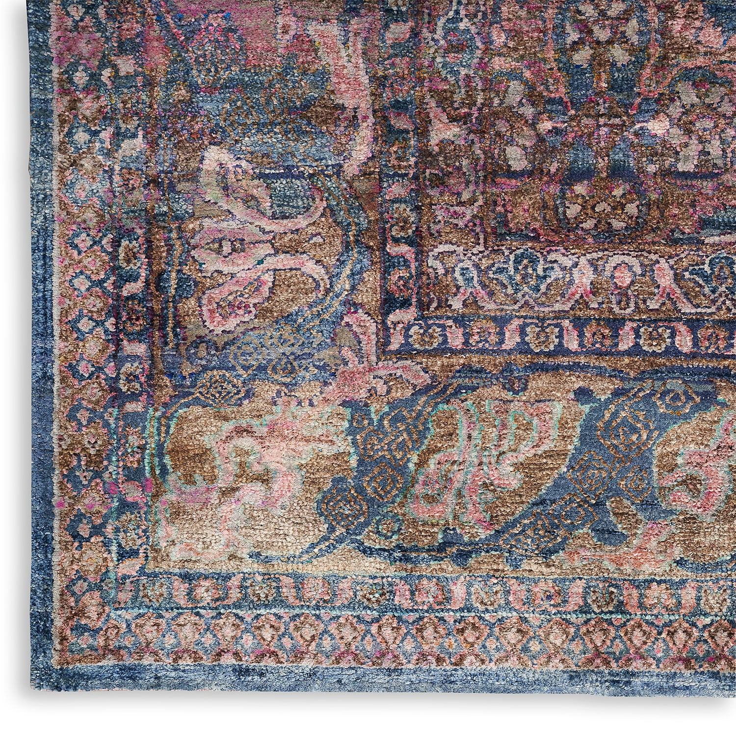Close-up of an intricately patterned traditional rug featuring vibrant colors.