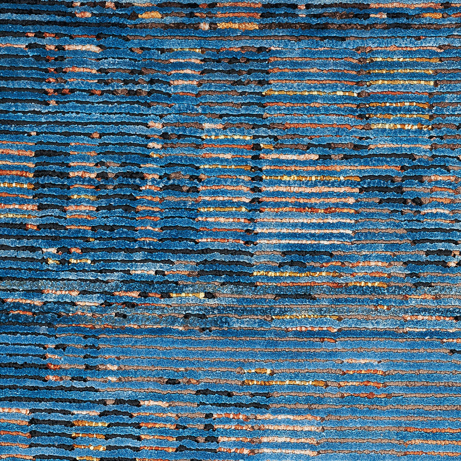 Abstract pattern of varying horizontal stripes in blue, orange, and rust.