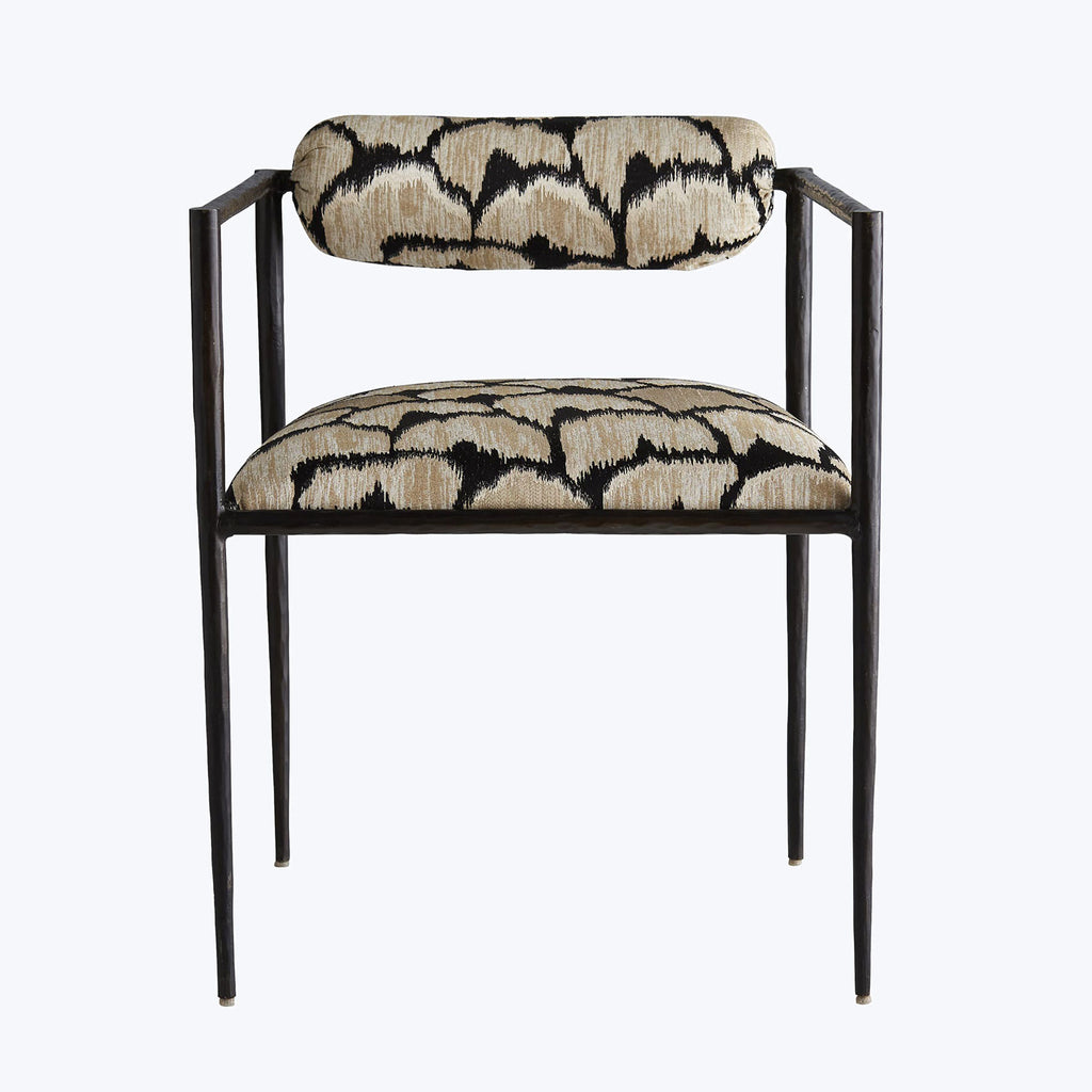 Modern-style chair with sleek metal frame and bold animal-print upholstery