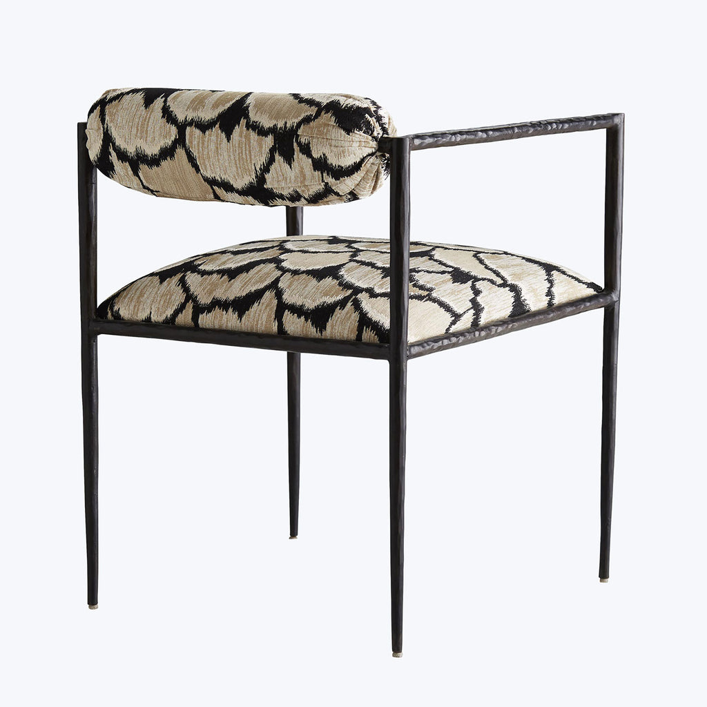Modern chair with dark metal frame and eye-catching animal print upholstery.