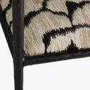 Modern chair with animal print upholstery adds eclectic touch to space.