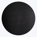 Abstract black circular object with a matte, depthless appearance.
