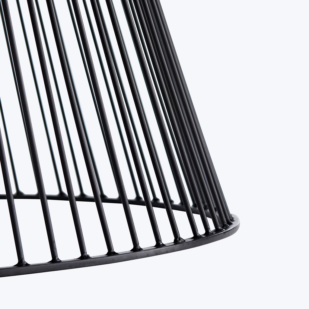 Close-up of a sleek wireframe chair with minimalist design.