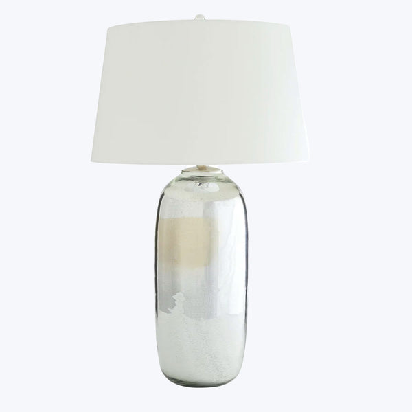 Modern table lamp with reflective silver base and elegant lampshade.