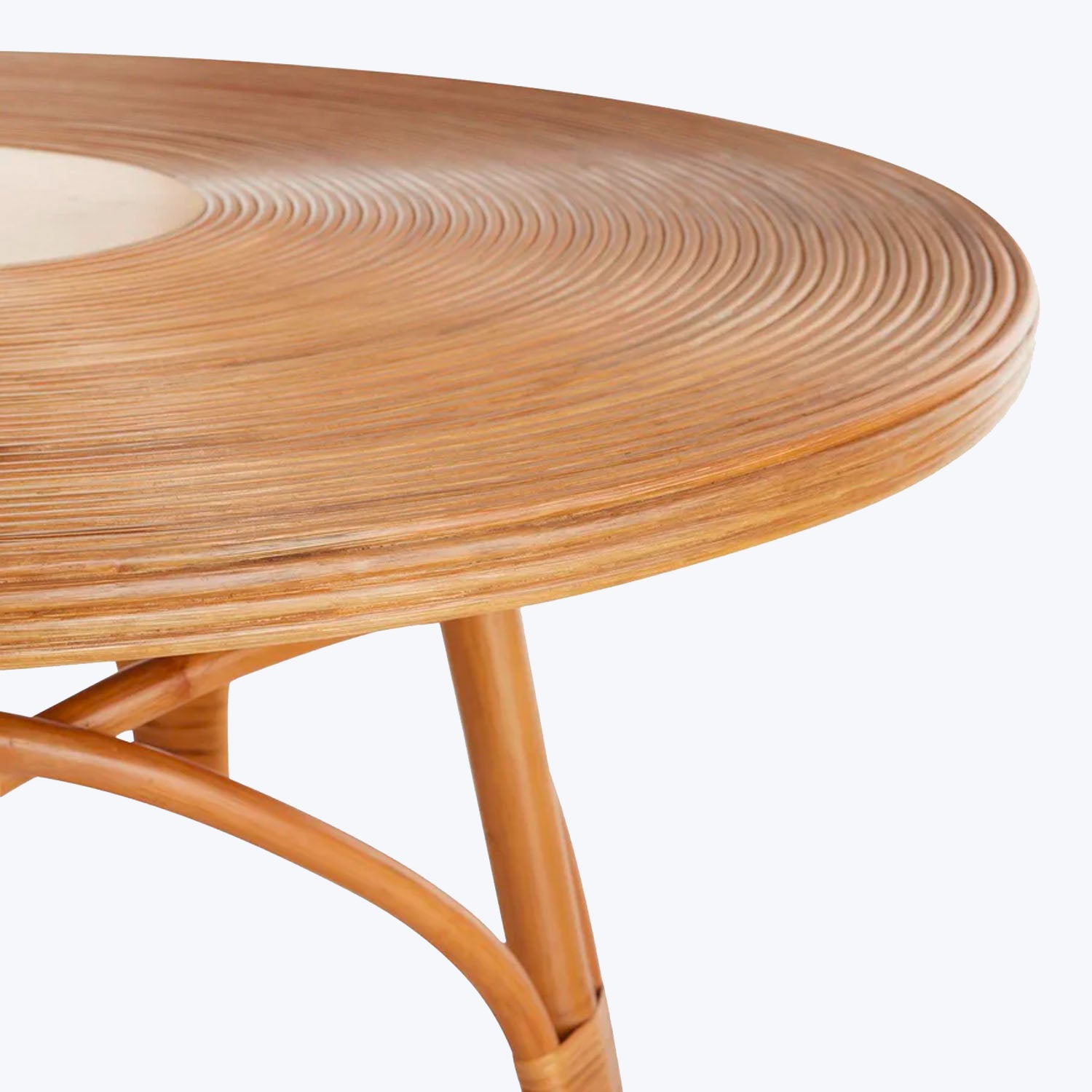 Modern wooden table with concentric ring pattern highlights natural grain.