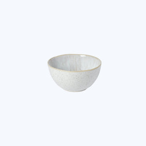 Simple, elegant ceramic bowl with speckled exterior and serene interior. - hover