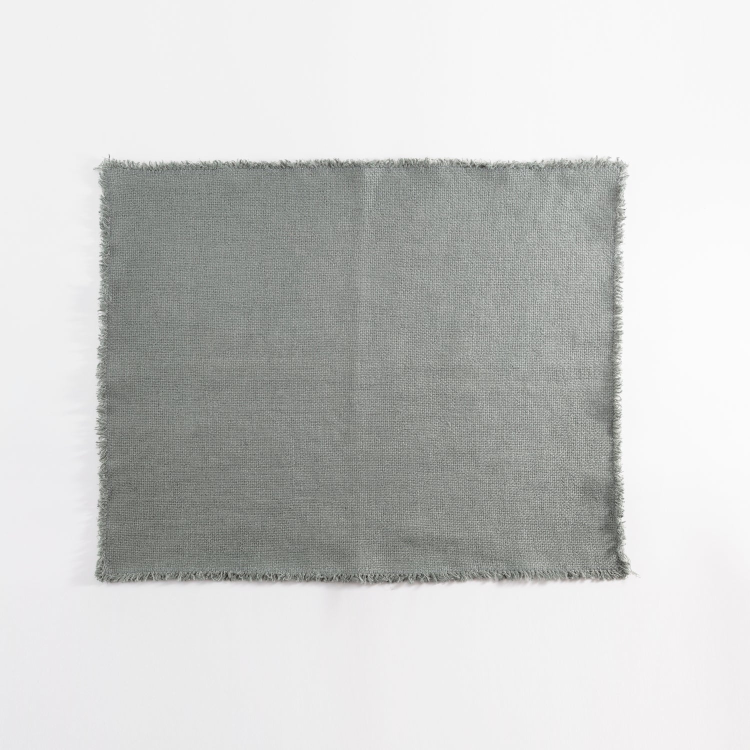 Grey fabric with frayed edges laid flat on white background.