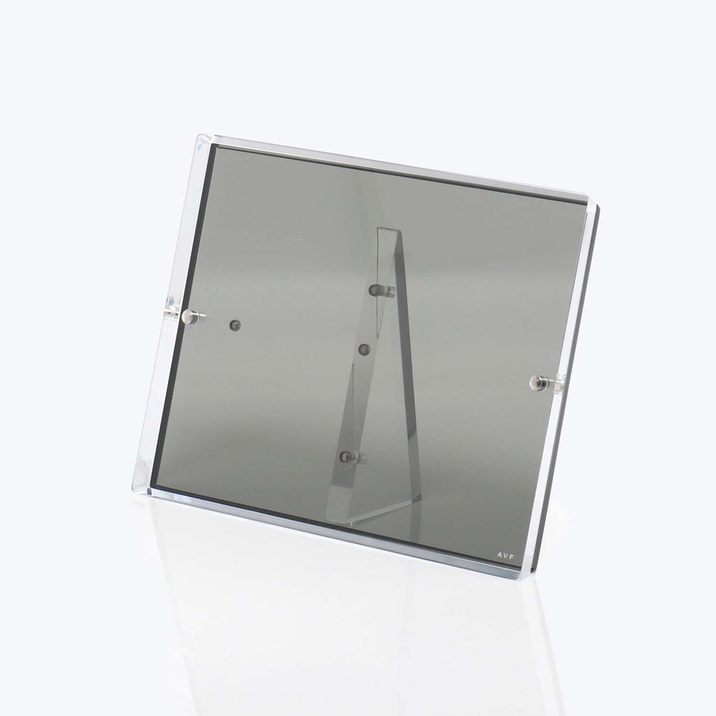 Modern transparent acrylic or glass box with AVF branding.