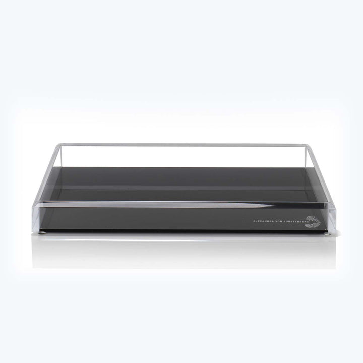 Modern acrylic tray with raised sides and sleek black base