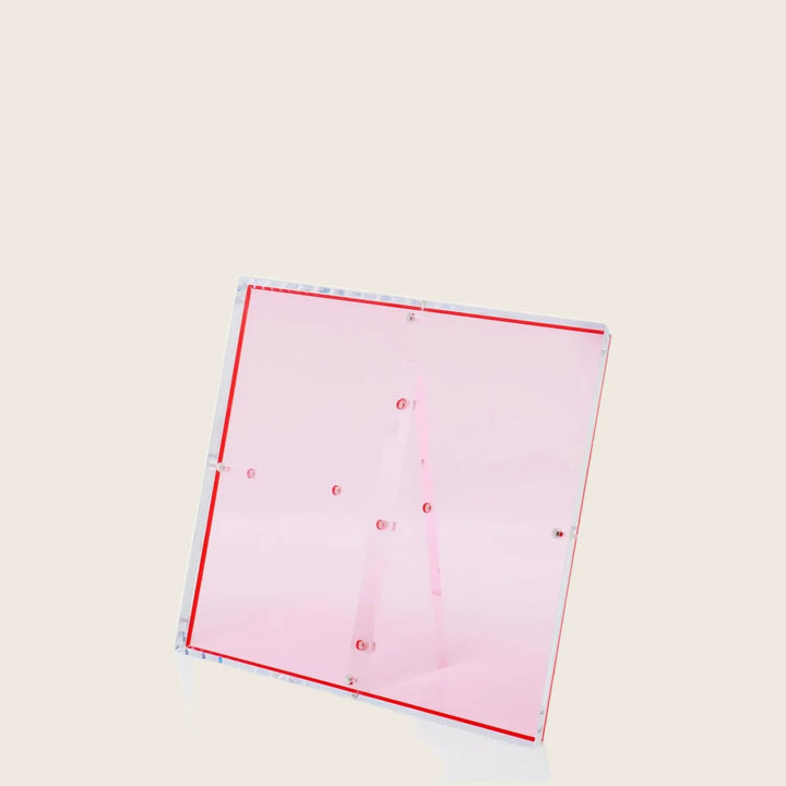 Modern pink acrylic lectern with sleek design and vibrant accents.