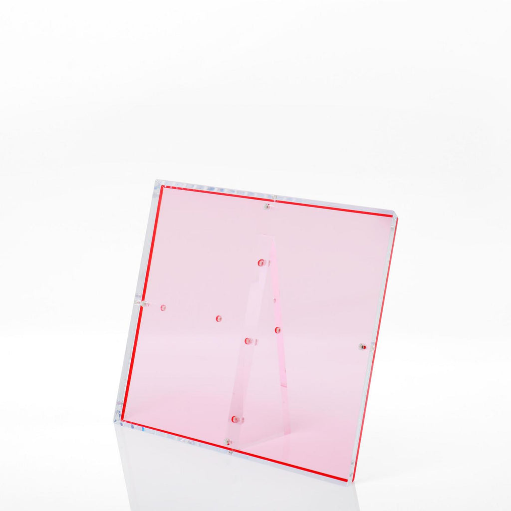 Modern pink acrylic lectern with sleek design and vibrant accents.
