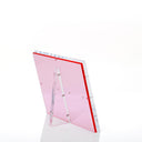 Modern, red-tinted acrylic sheet with reflective surface on display.