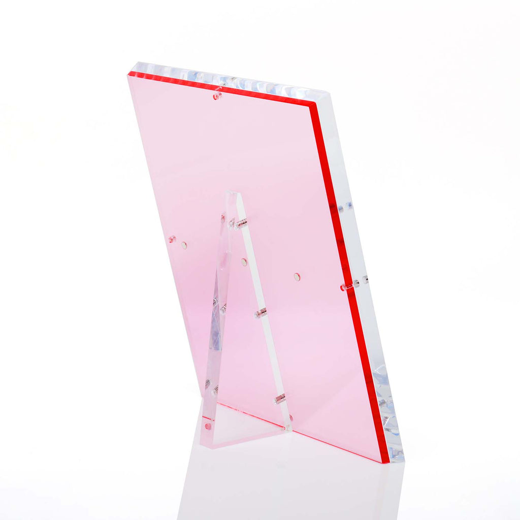 Rectangular pink acrylic panel with foldable support for display.