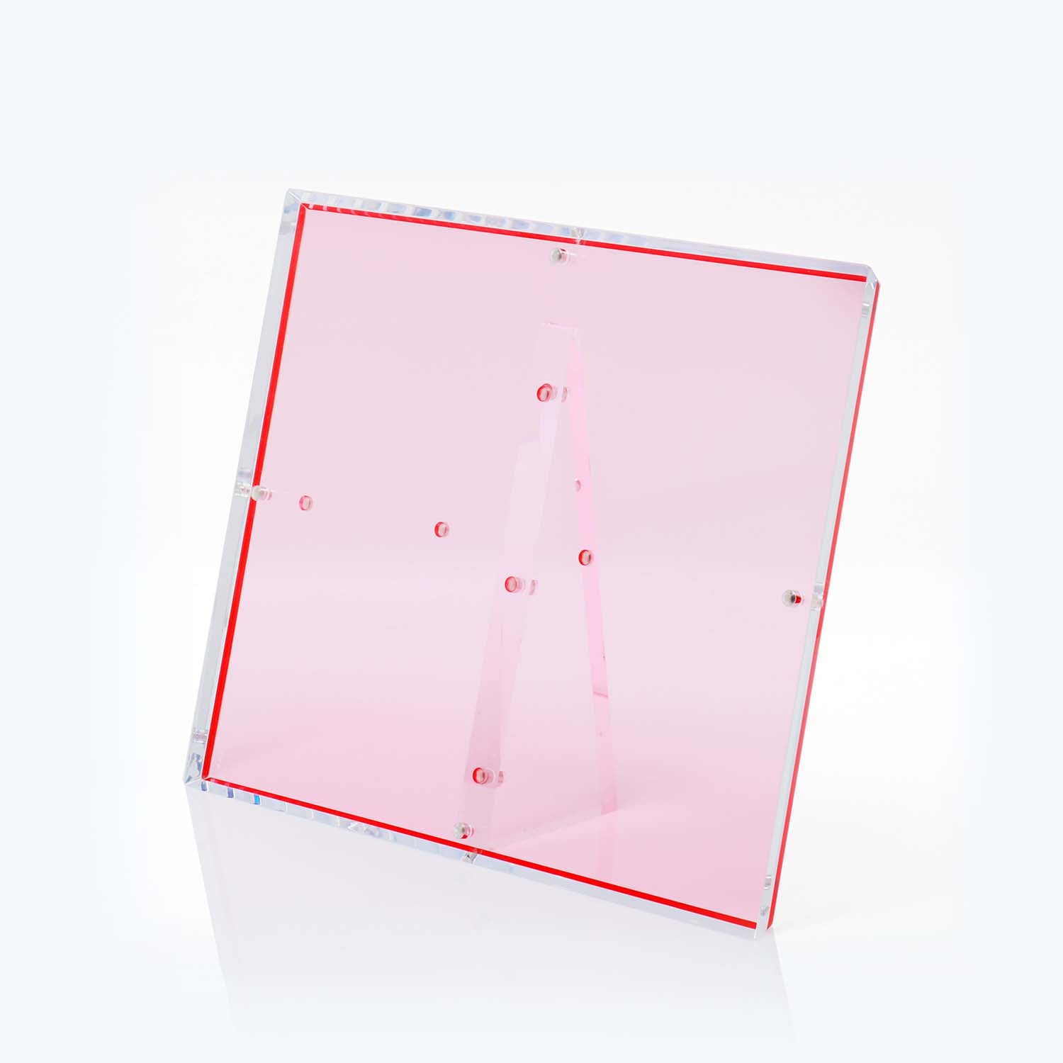 Modern pink acrylic lectern with transparent design against white background.