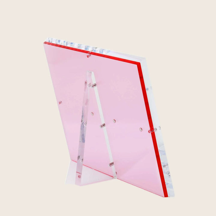 Pink acrylic sign holder with decorative beads, exuding minimalist elegance.