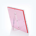 Pink acrylic sign holder with decorative beads, exuding minimalist elegance.
