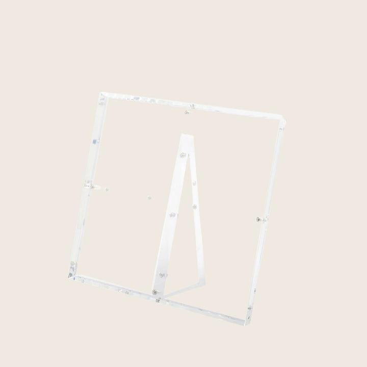 Minimalist acrylic stand with transparent panels for versatile displays.