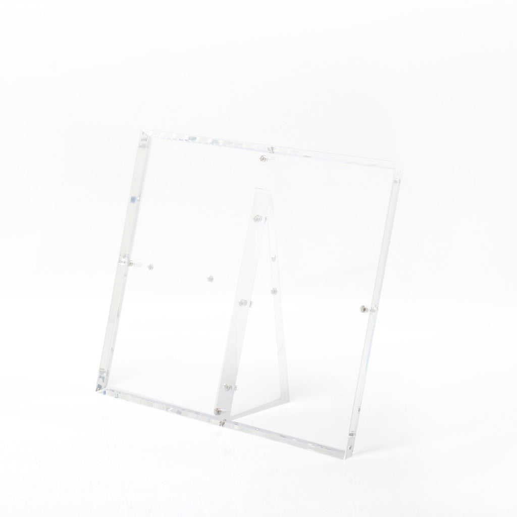 Minimalist acrylic stand with transparent panels for versatile displays.