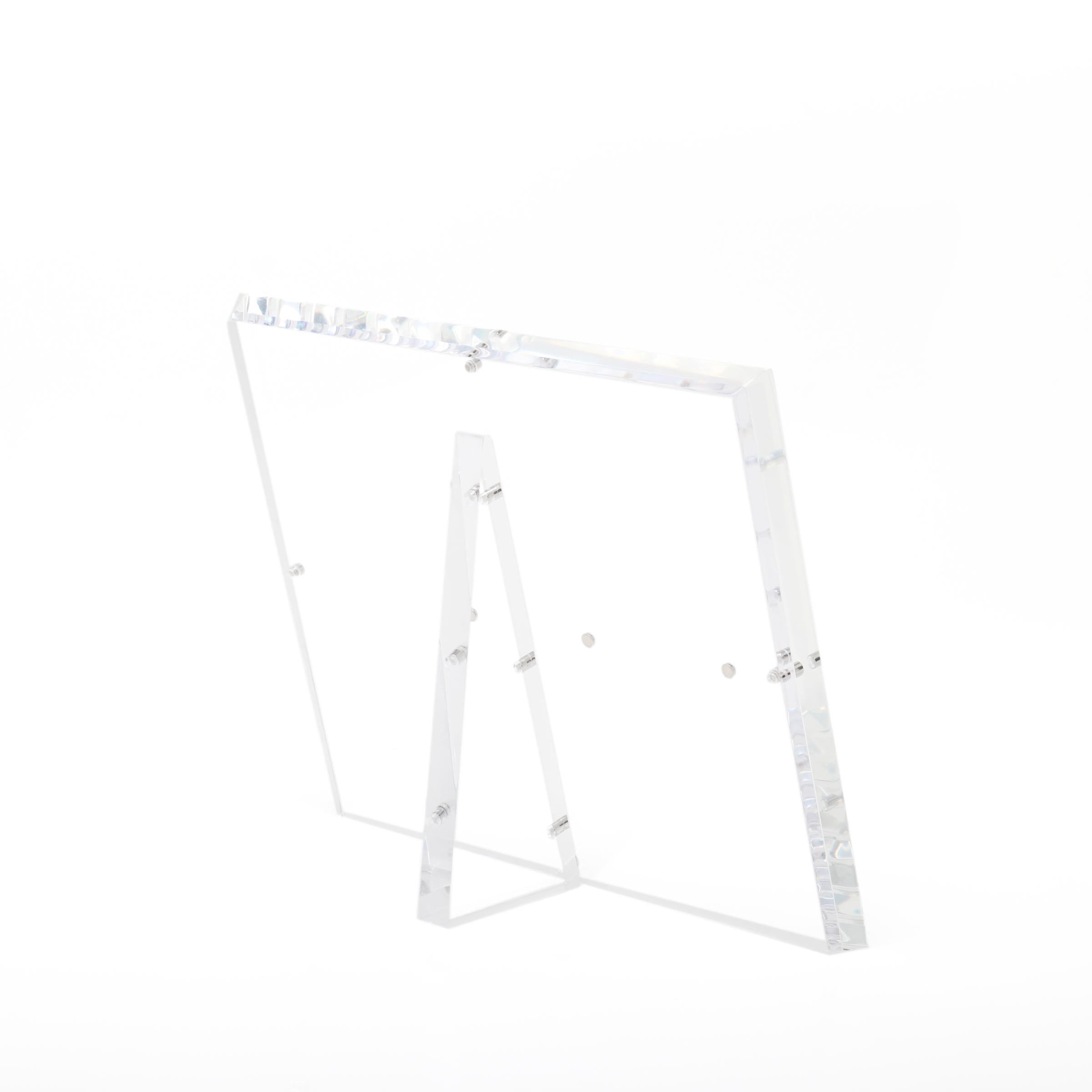 Minimalistic and elegant acrylic easel showcases items with modern design.