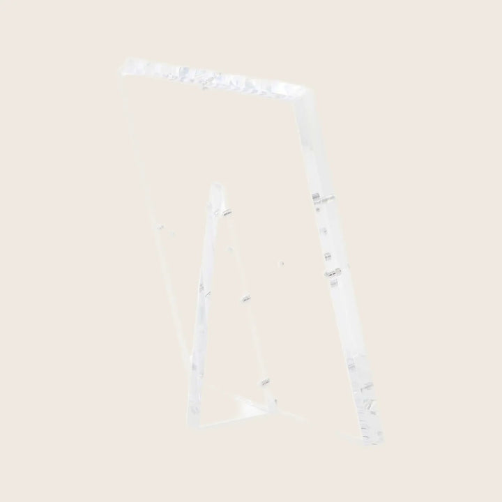 Minimalist clear acrylic stand with glossy finish and modern design.