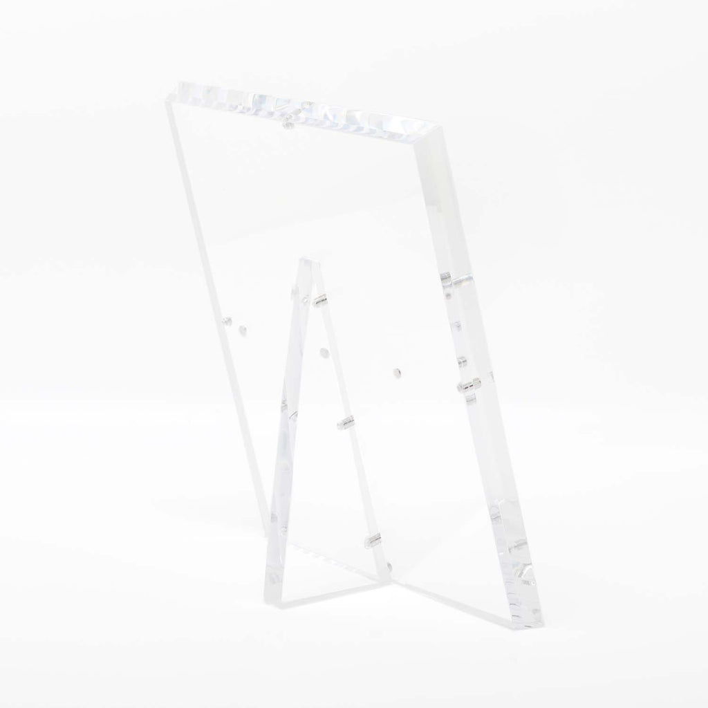 Minimalist clear acrylic stand with glossy finish and modern design.