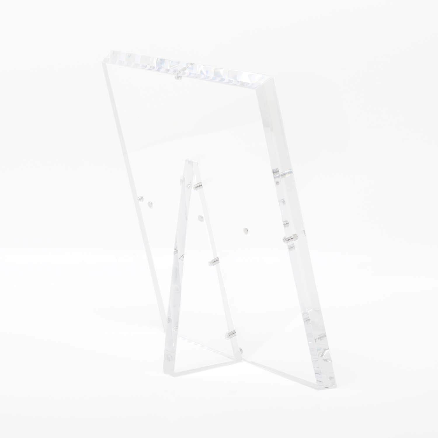 Minimalist clear acrylic stand with glossy finish and modern design.