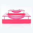 Contemporary acrylic table accessory by Alexandra von Furstenberg in pink.