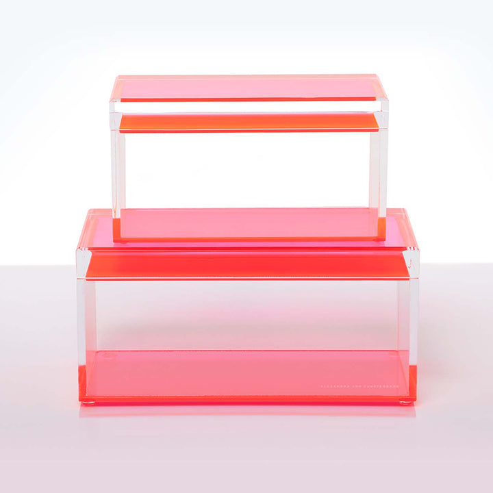 Modern acrylic display stand in bright pink with clean lines.
