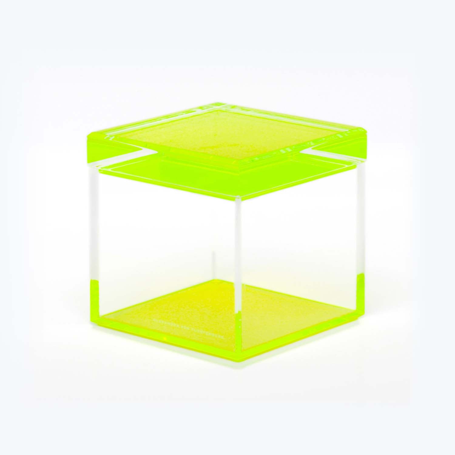 Vibrantly colored translucent sculpture with minimalist design against white background.