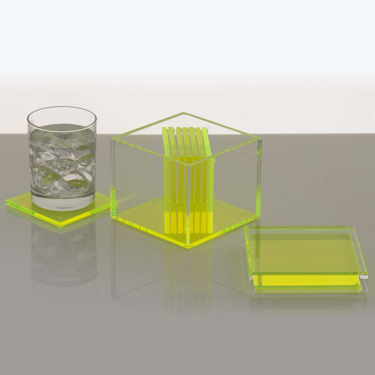 Minimalistic, modern laboratory setup with neon yellow acrylic test tube rack and lid.