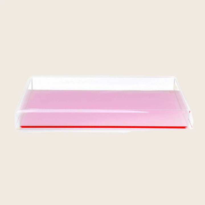 Rectangular pink-tinted tray with glossy surface and translucent plastic material.