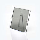 Minimalistic acrylic frame with reflective surface and AVF logo.