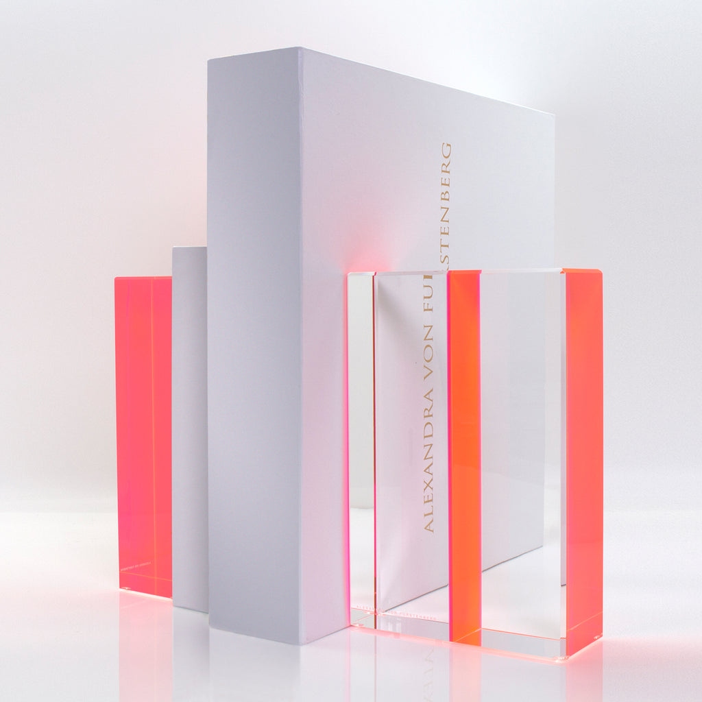 Vibrant pink acrylic awards by Alexandra von Furstenberg on display.