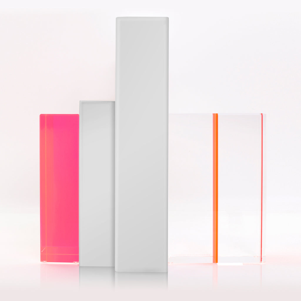 Four vertical bars in varying heights and colors on plain background.