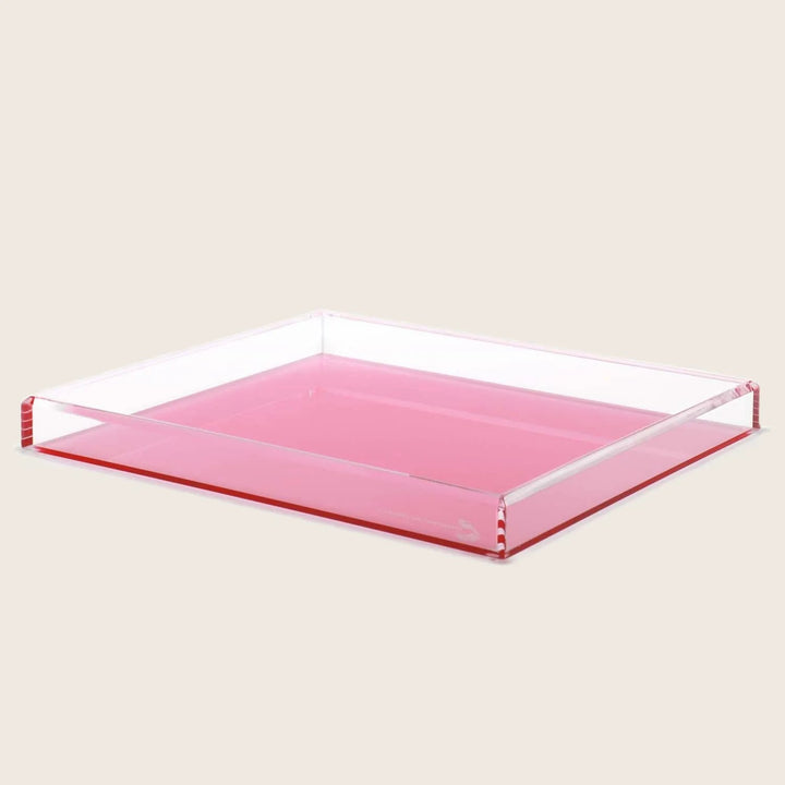 Stylish pink acrylic tray with transparent and shiny appearance.