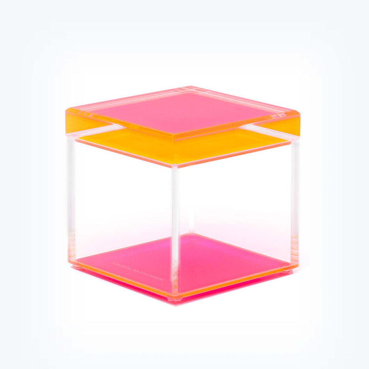 Cuboid acrylic sculpture with vibrant pink and orange panels.