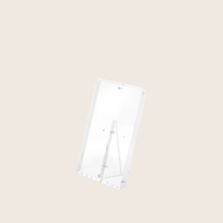Clear acrylic stand with slanted back leg for optimal visibility.