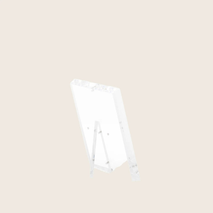 Transparent acrylic easel showcases minimalist design with sleek simplicity.