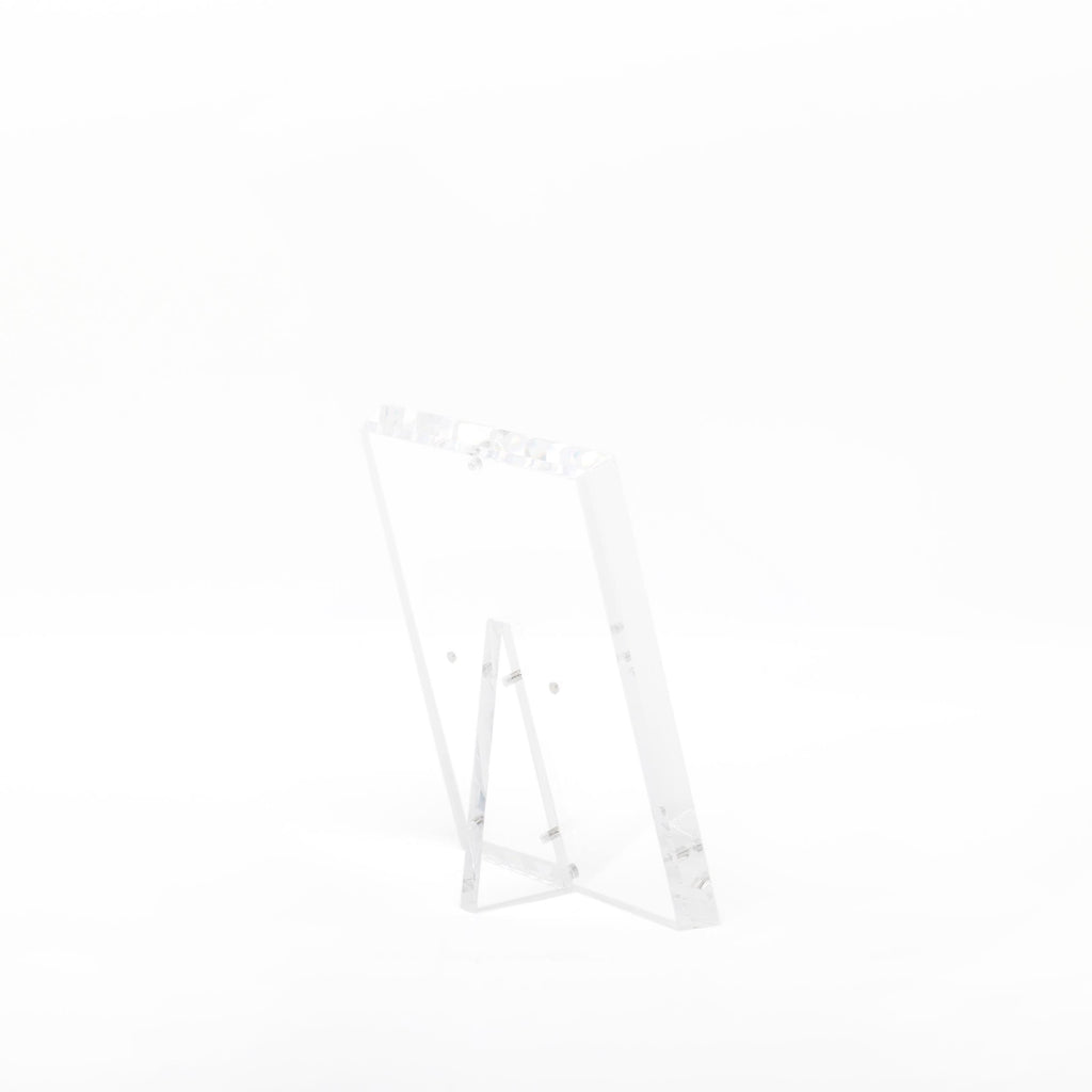 Transparent acrylic easel showcases minimalist design with sleek simplicity.