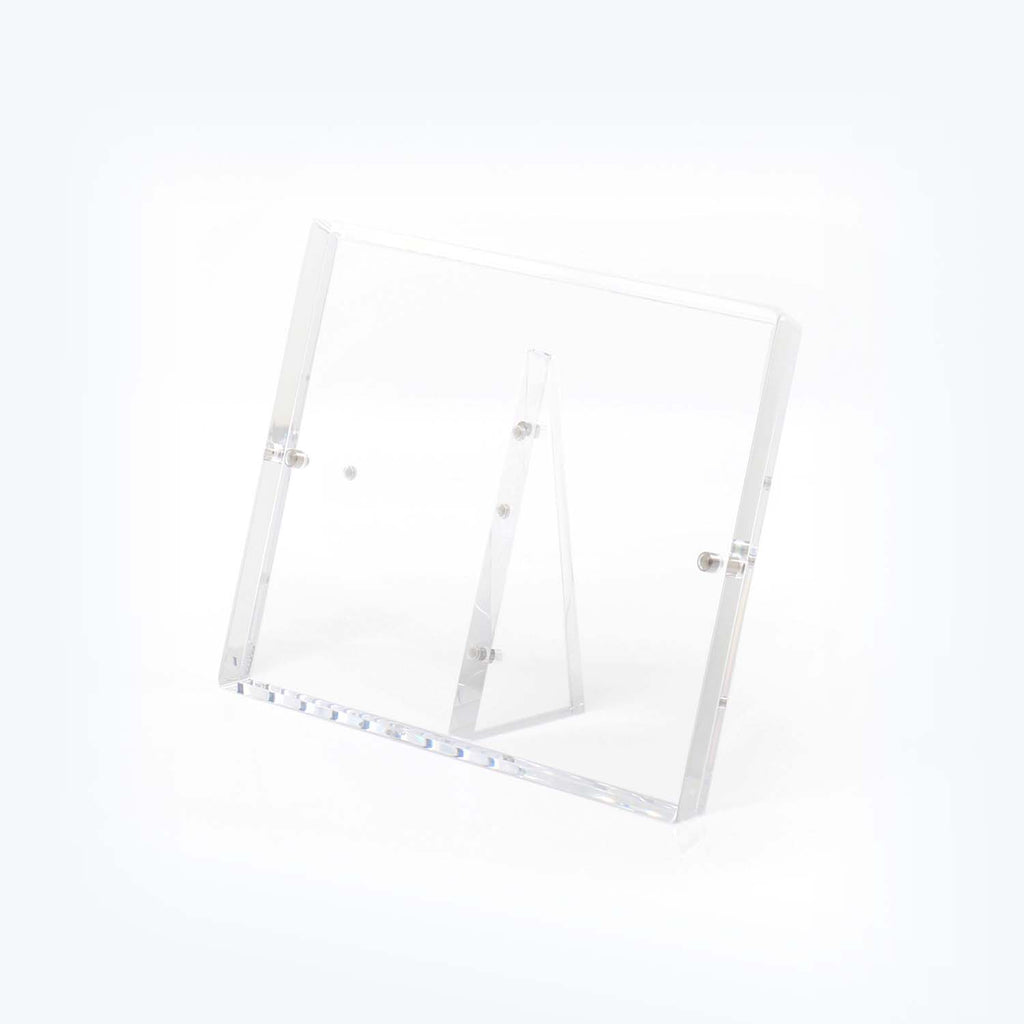 Minimalist clear acrylic stand showcases items with elegance and versatility.