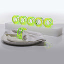 Futuristic dining set-up featuring illuminated neon green rings backdrop.