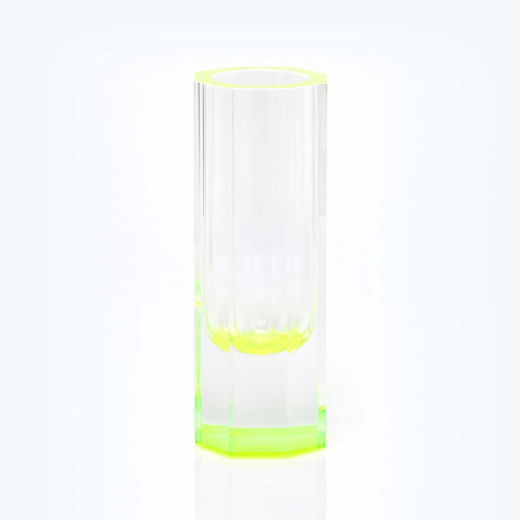 A transparent green-tinted glass showcasing its sleek cylindrical design.