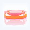 Vibrant, modern acrylic object with gradient colors and sleek design.